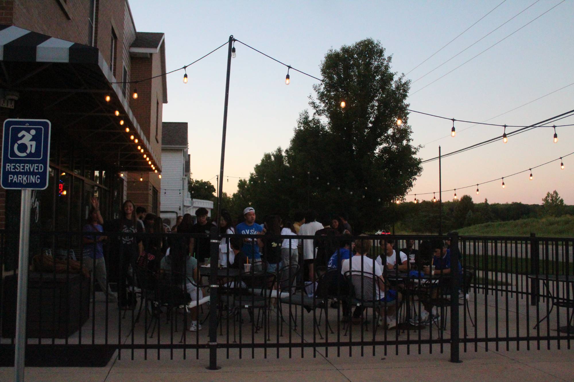Students drink boba and hang out on the Tea Time patio during ASAP Welcome with Laker Familia.
